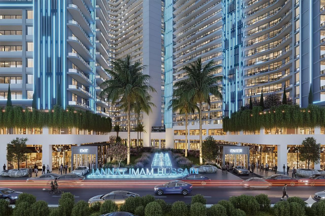 Jannat Imam Hussain Towers evening view with illuminated entrance