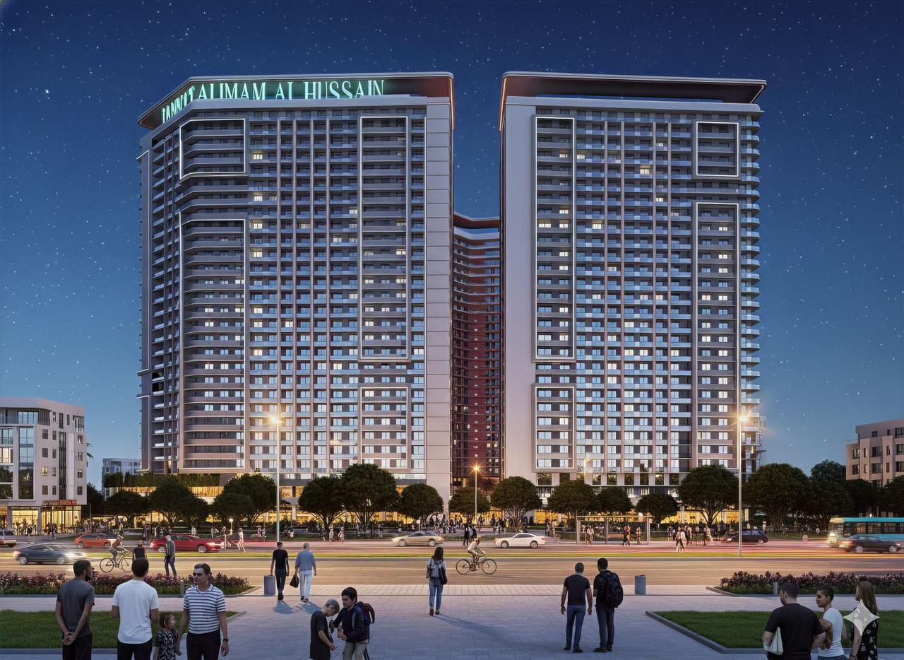 Evening view of twin towers with illuminated signage